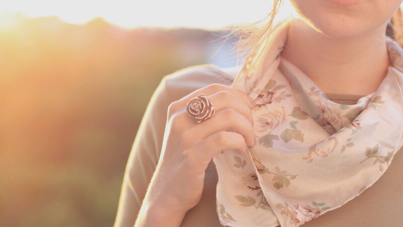 Woman with Rose Ring — Beige, Serene, Sunset