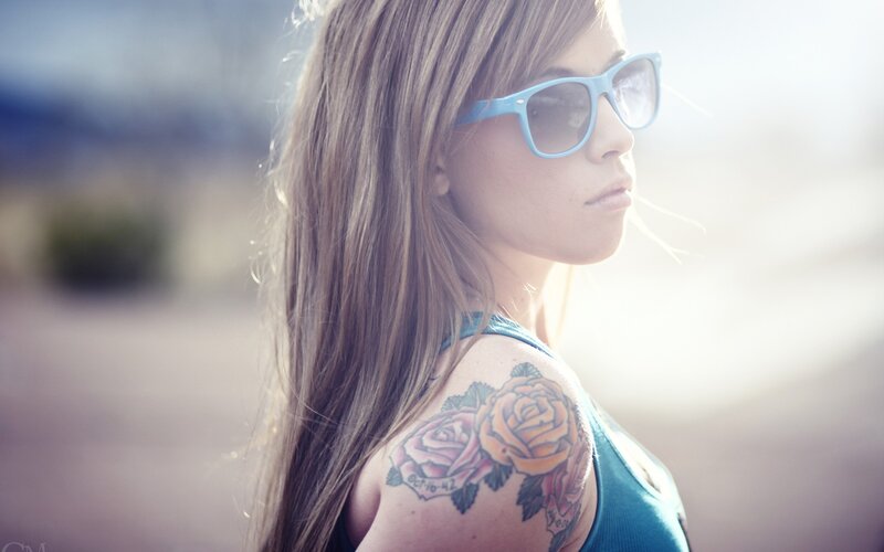 woman with rose tattoo