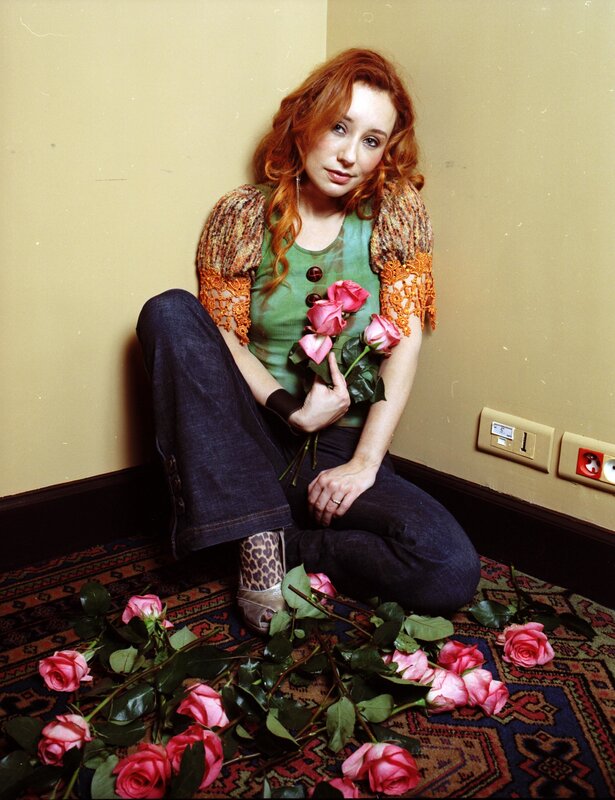 Woman with roses in corner