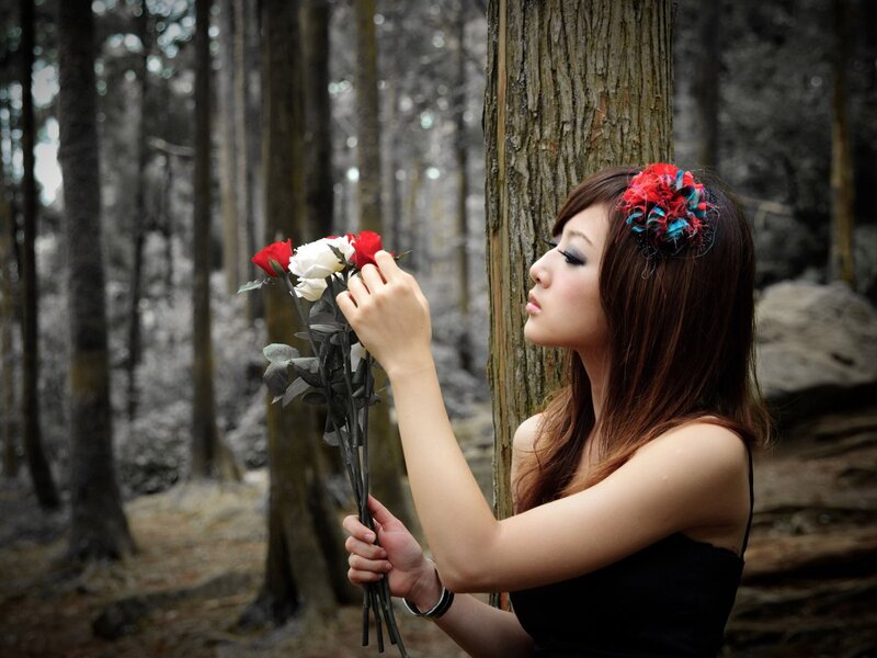 woman with roses in forest