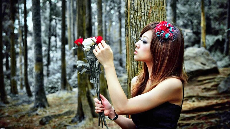 woman with roses in forest