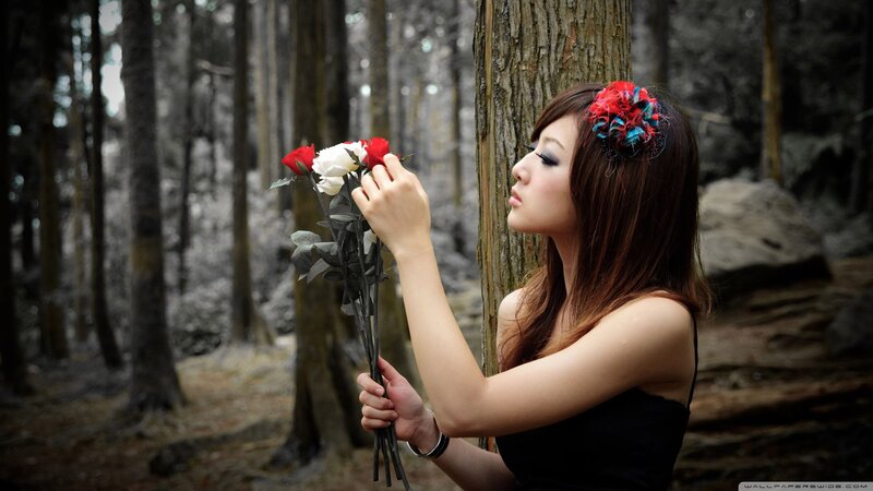 woman with roses in forest