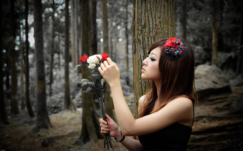 woman with roses in forest