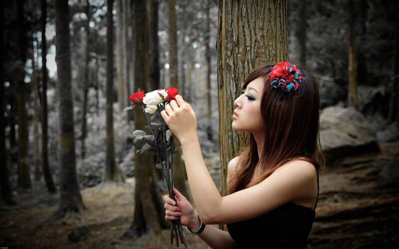 woman with roses in forest