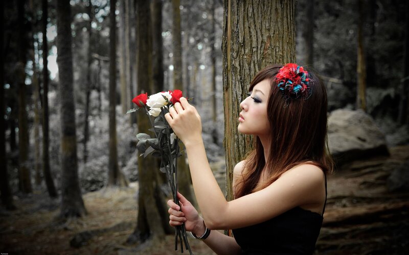 woman with roses in forest