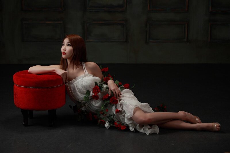 Woman with roses on floor