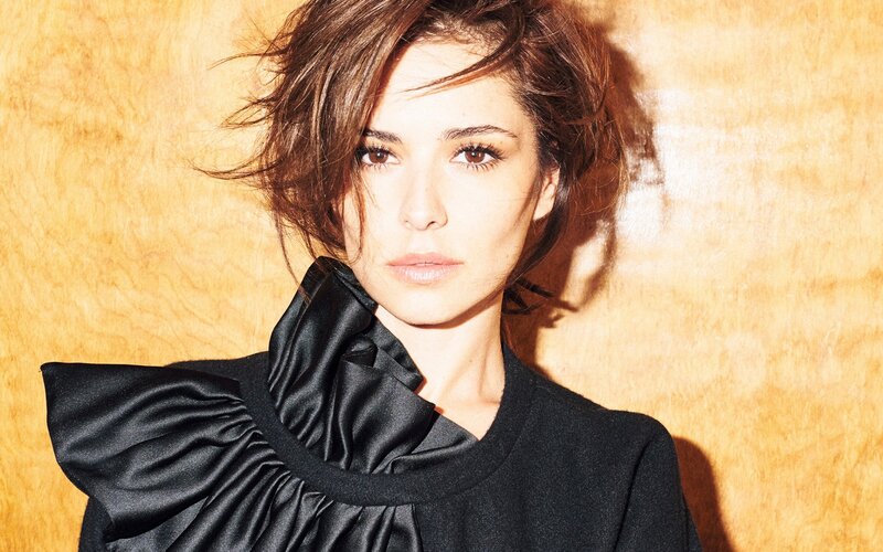 woman with ruffled black top