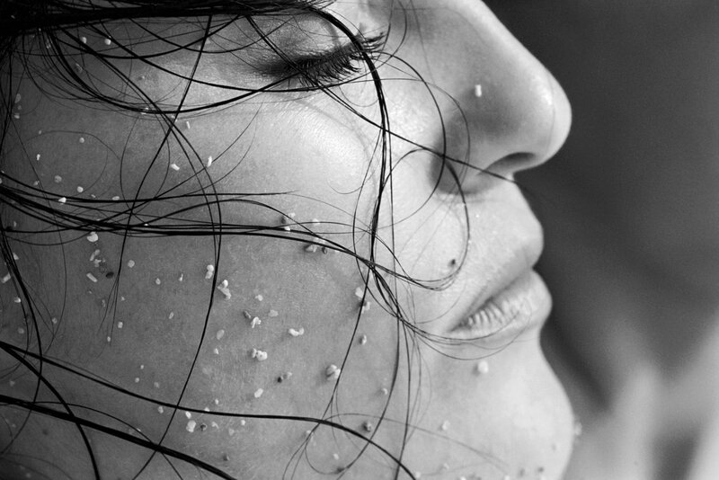 woman with sand on her face