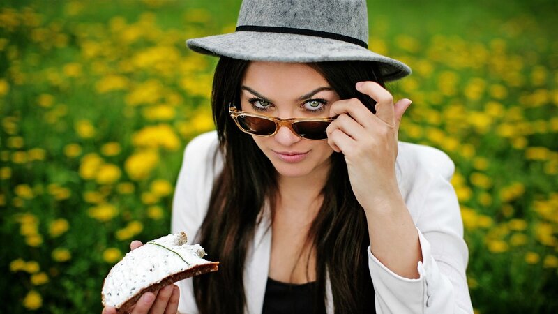 woman with sandwich in field