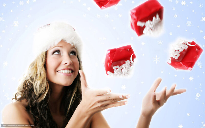 woman with santa hat and gifts