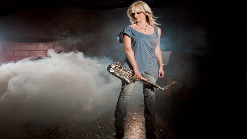 woman with saxophone in smoke