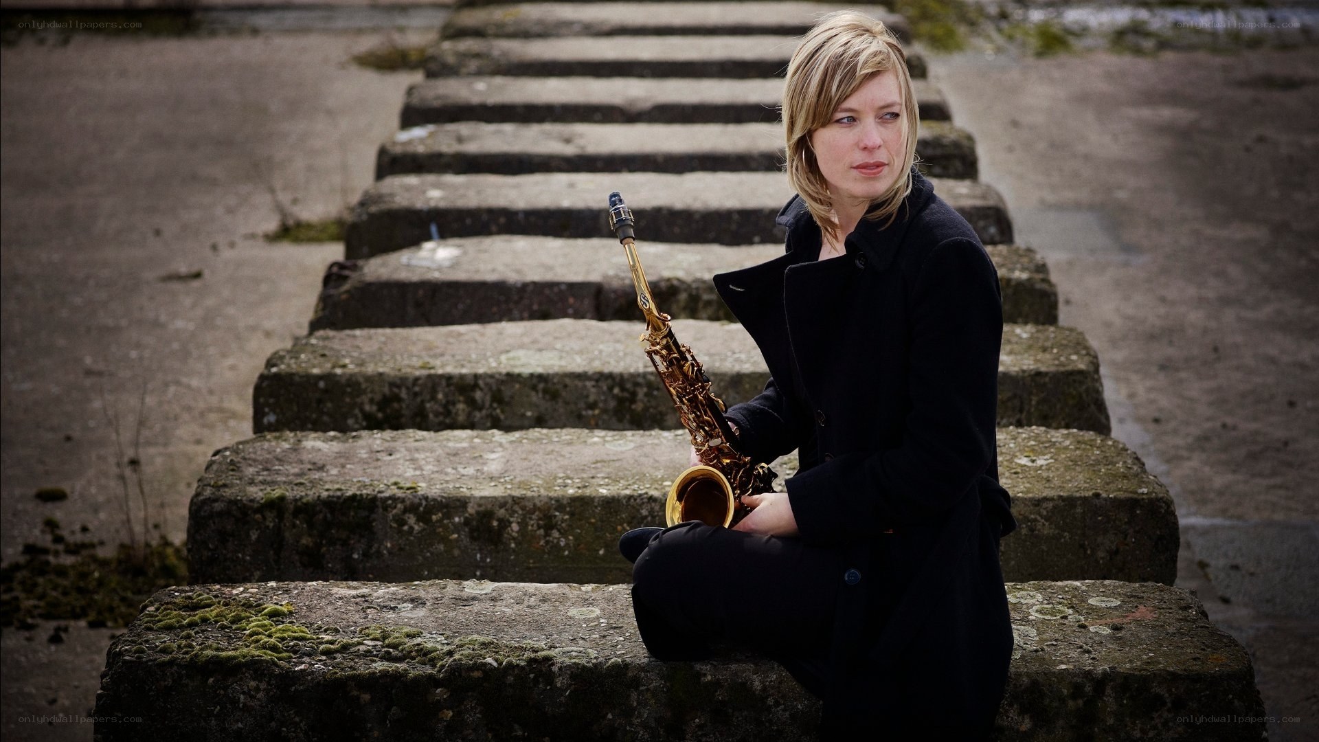 Woman with saxophone on steps