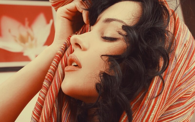 woman with scarf and closed eyes