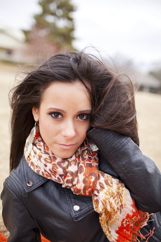 woman with scarf and leather jacket