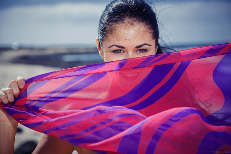 woman with scarf at beach