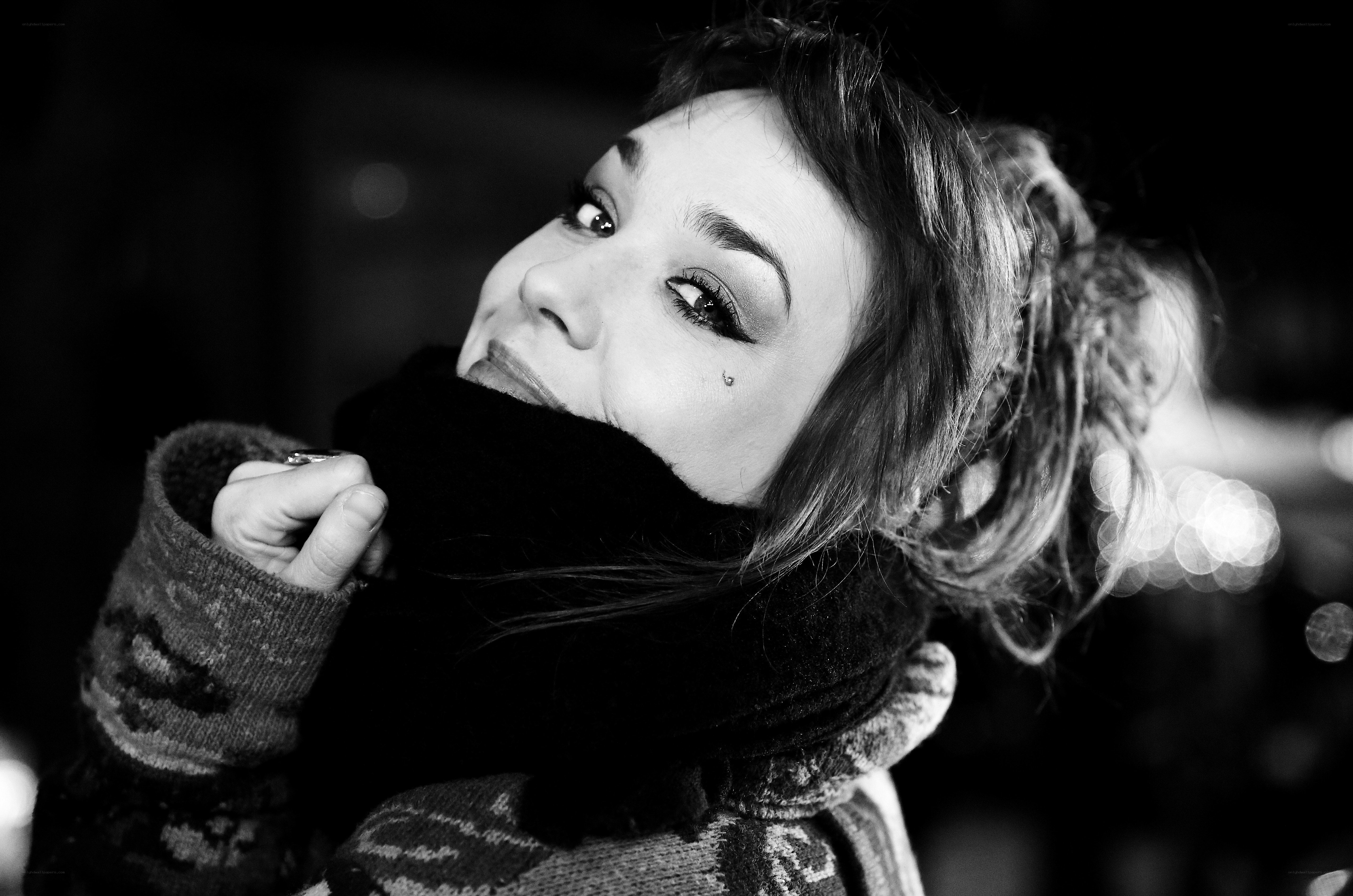 woman with scarf at night