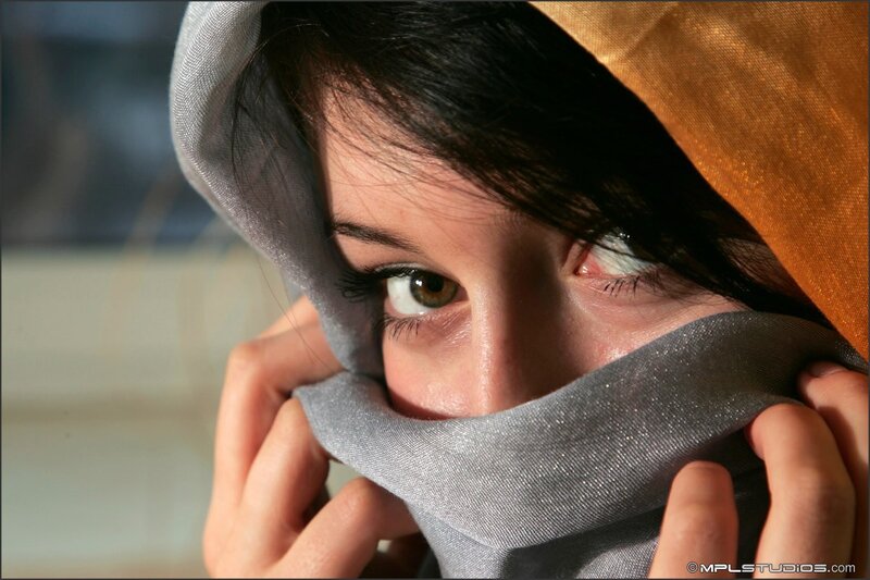woman with scarf covering face