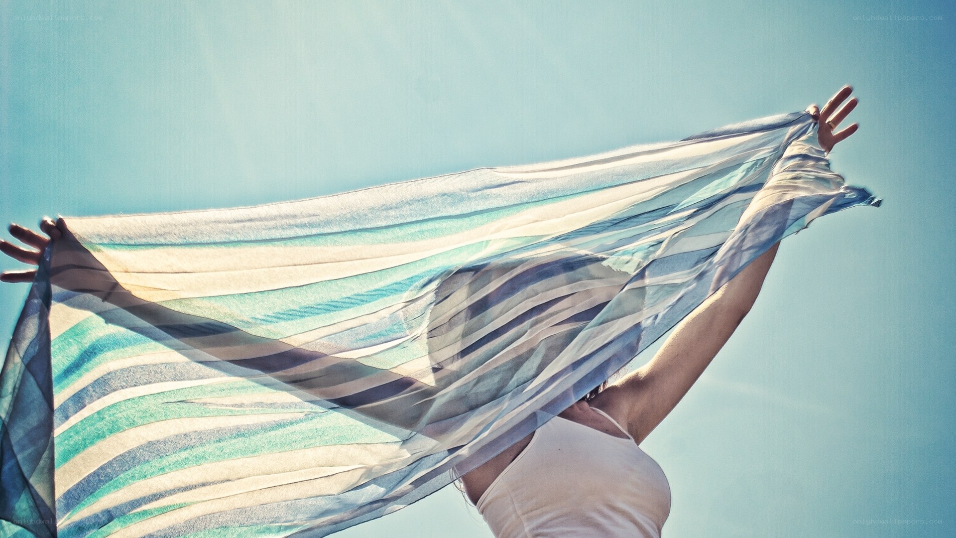 woman with scarf in sky