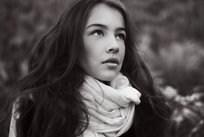 woman with scarf looking up