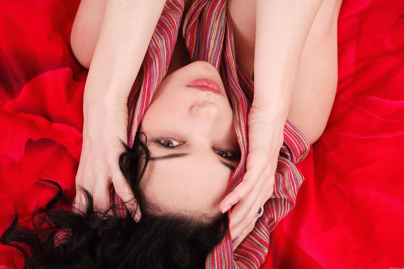 woman with scarf on red bed