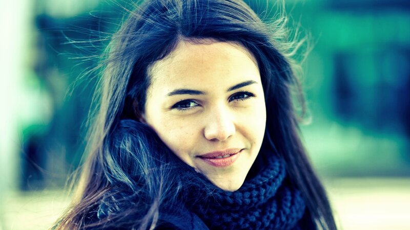 woman with scarf smiling