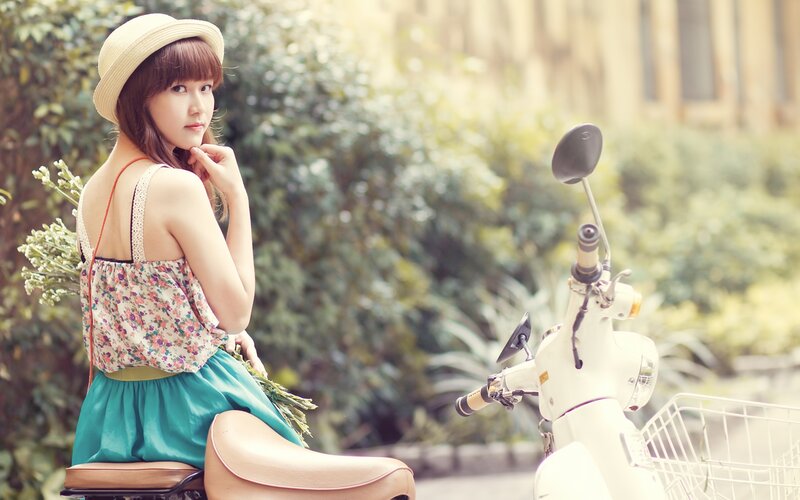 woman with scooter and flowers