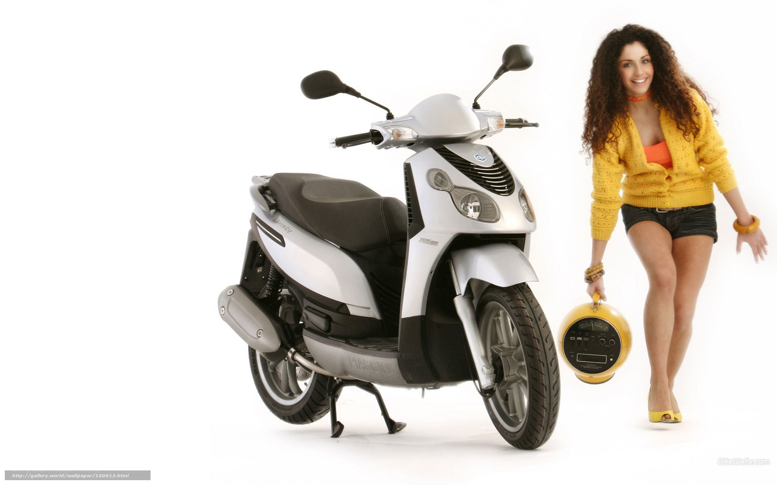 woman with scooter and helmet