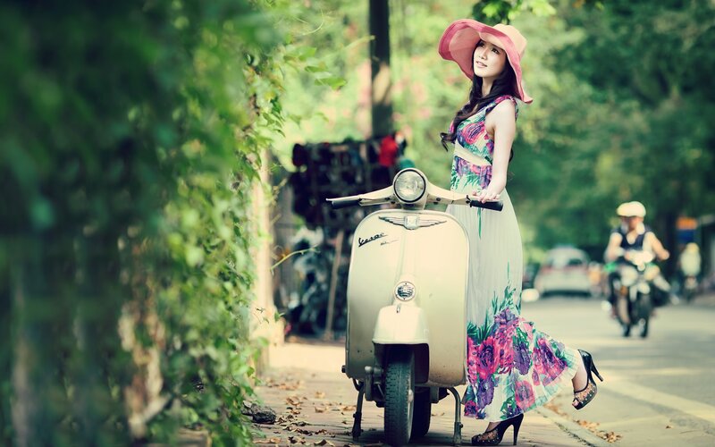 Woman with scooter in garden