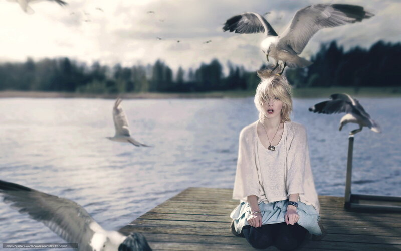 woman with seagulls on dock
