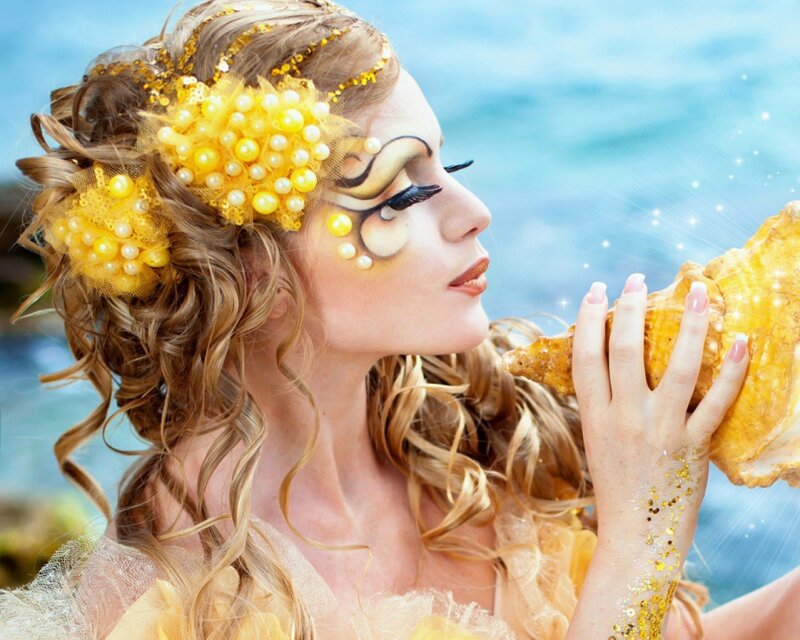 woman with seashell and makeup