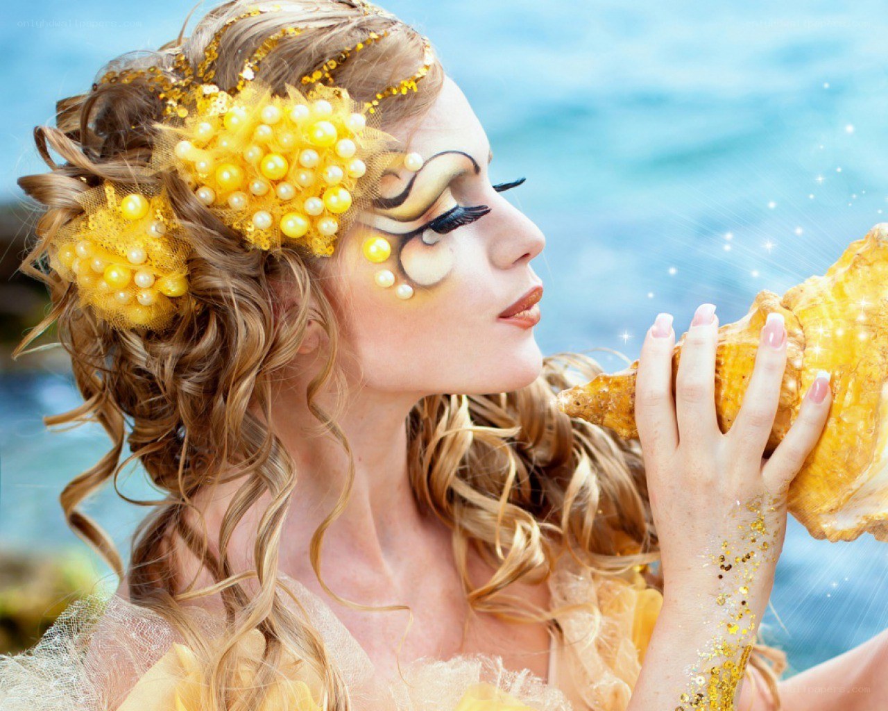 woman with seashell and makeup