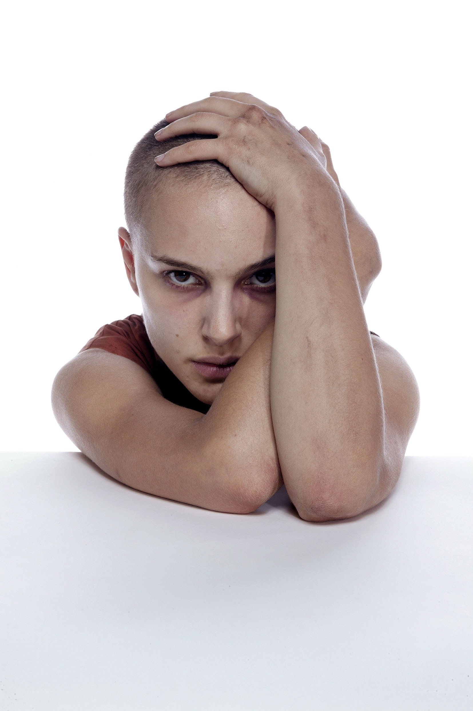 woman with shaved head resting