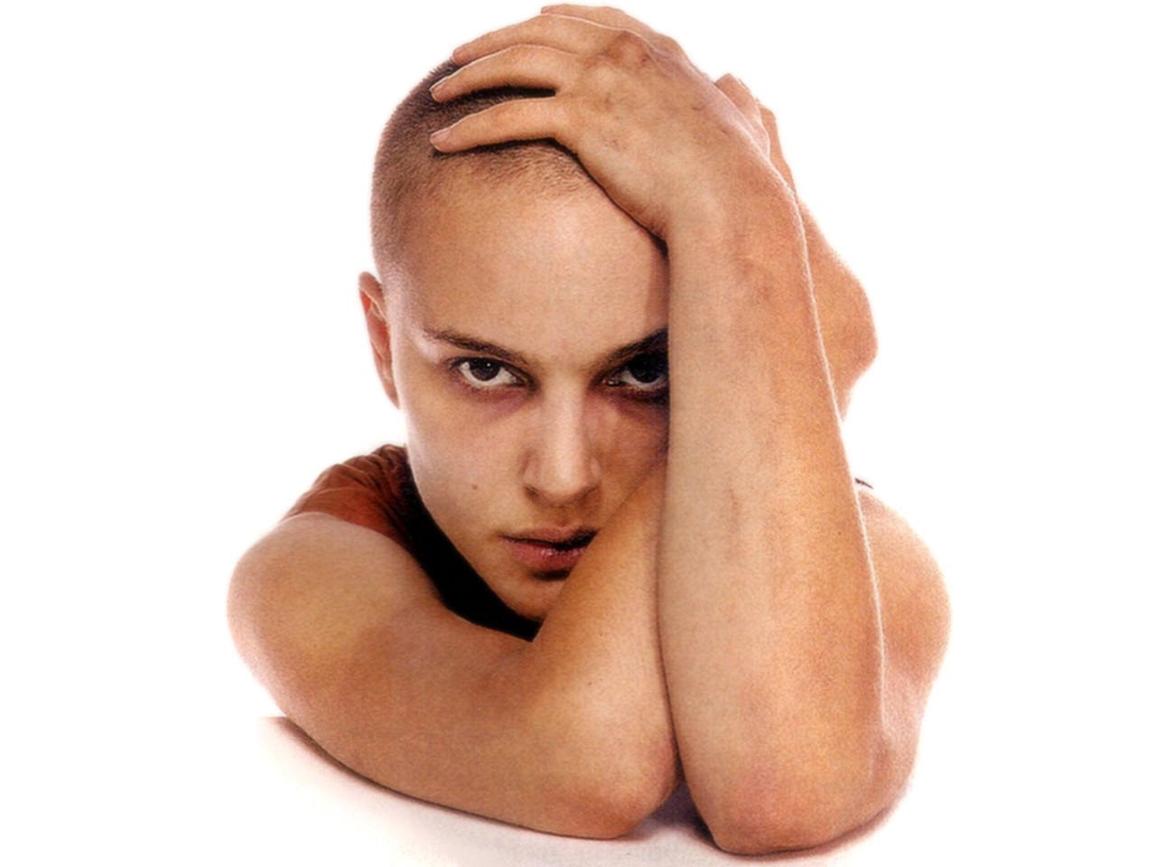 woman with shaved head resting