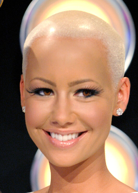 woman with shaved head smiling