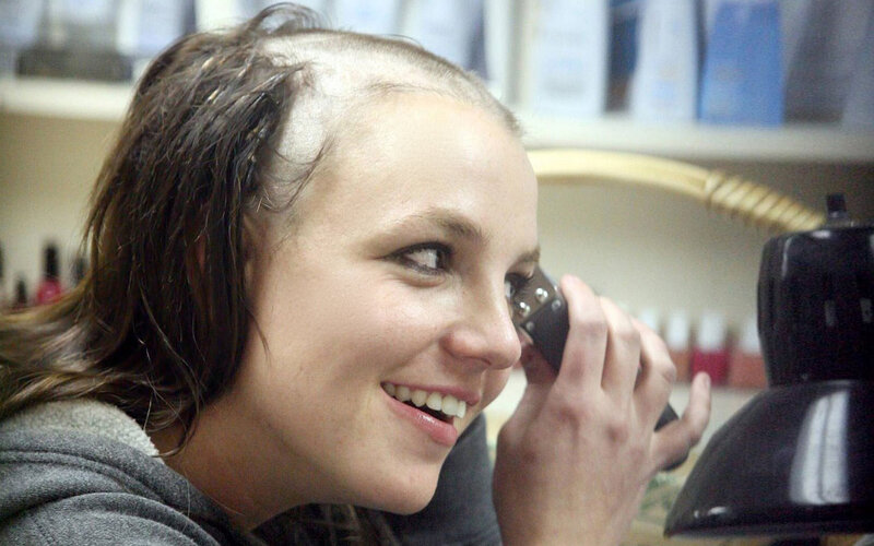 woman with shaved head smiling