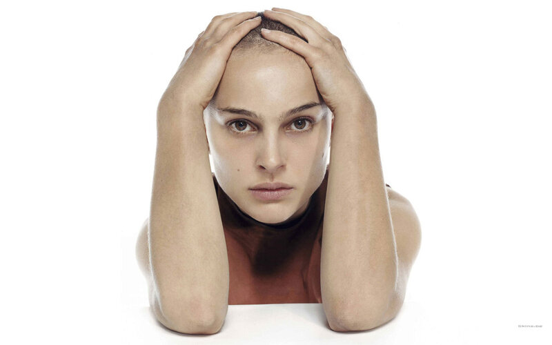 Woman with Shaved Head — White, Serious