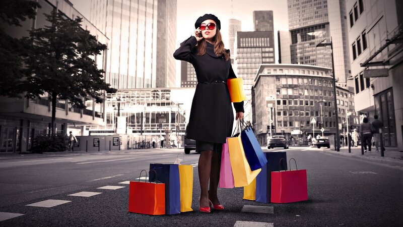 Woman with shopping bags in city