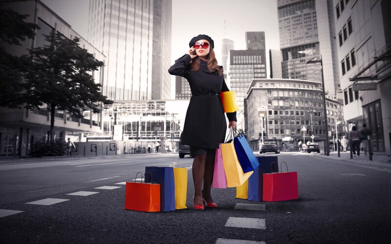 Woman with shopping bags in city