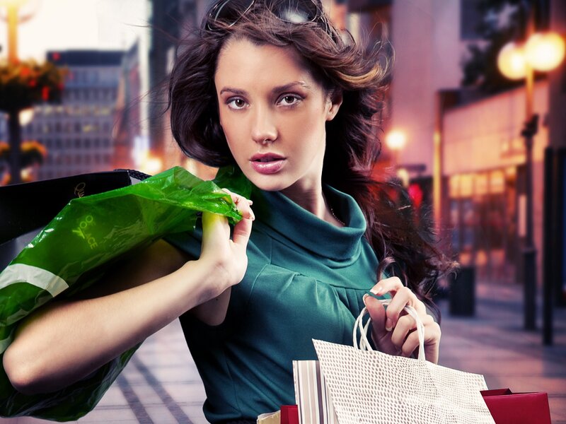woman with shopping bags on street