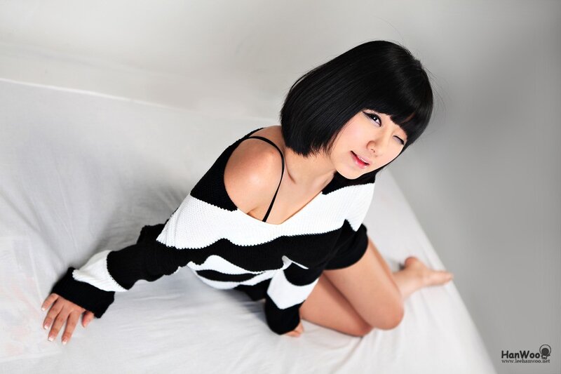 Woman with Short Black Hair — Neutral, Photograph, Bed