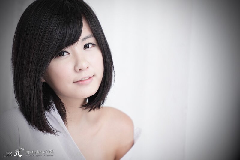 Woman with Short Black Hair — White, Calm, Photograph