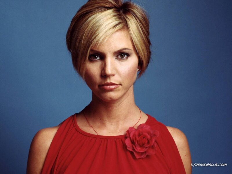 Woman with Short Blonde Hair — Red, Serious