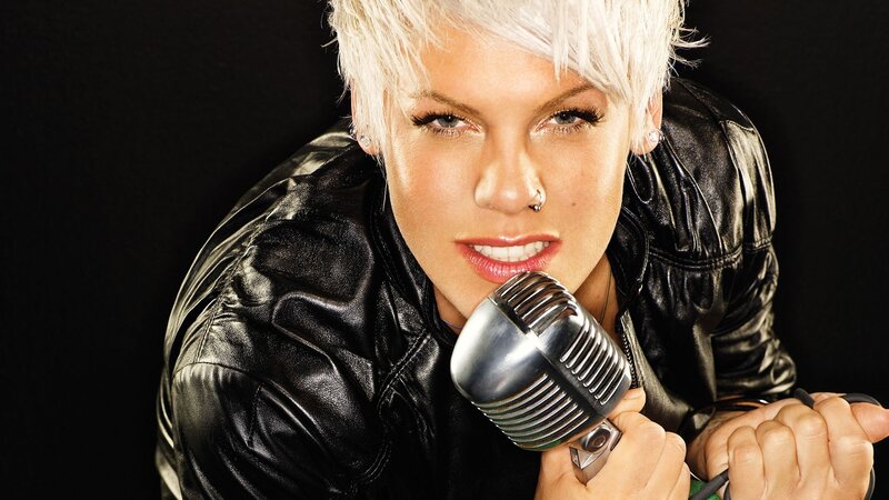 woman with short blonde hair singing