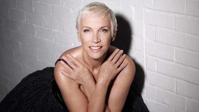 Woman with Short Blonde Hair — White, Confident, Photograph, White Brick Wall