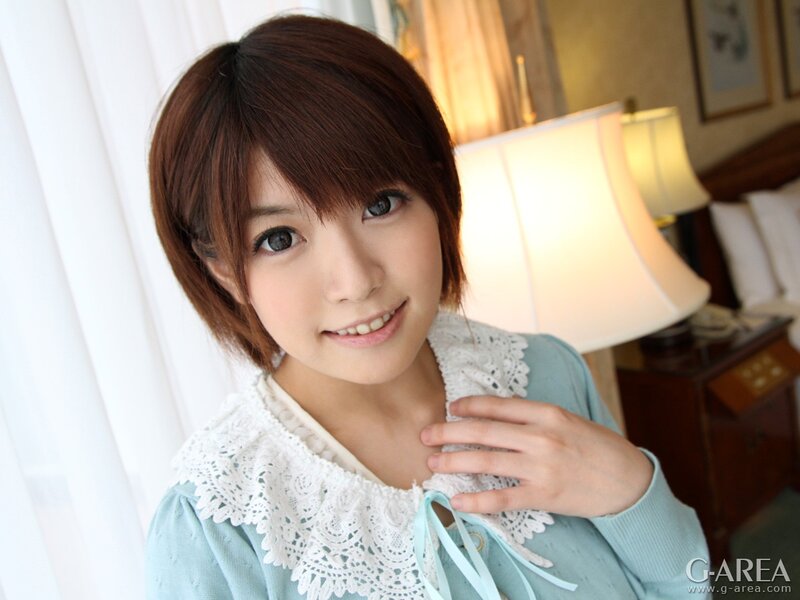 woman with short brown hair smiling