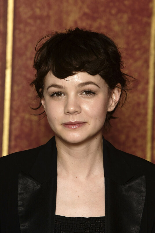 Woman with Short Dark Hair — Black, Neutral, Photograph, Black Jacket, Patterned Wall