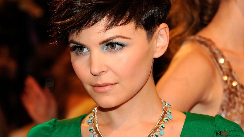 woman with short hair and blue eyeshadow