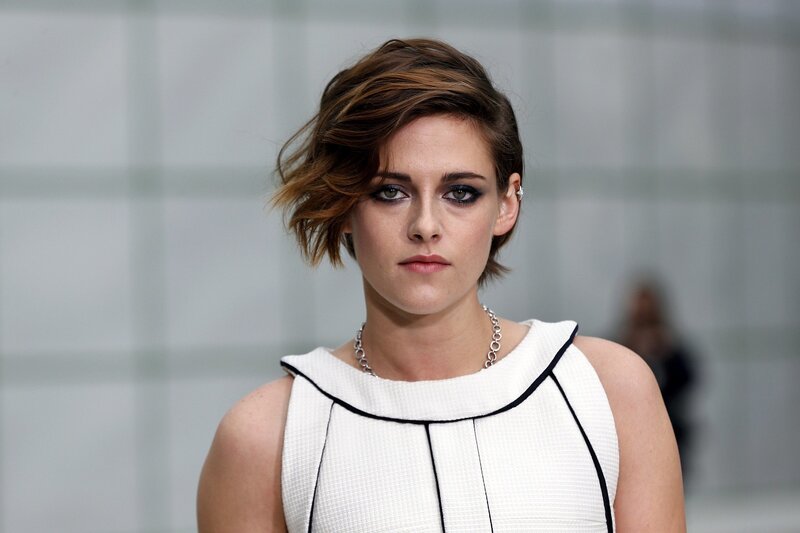woman with short hair and dark makeup