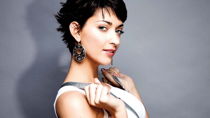 woman with short hair and earrings
