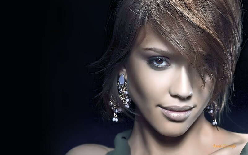woman with short hair and earrings